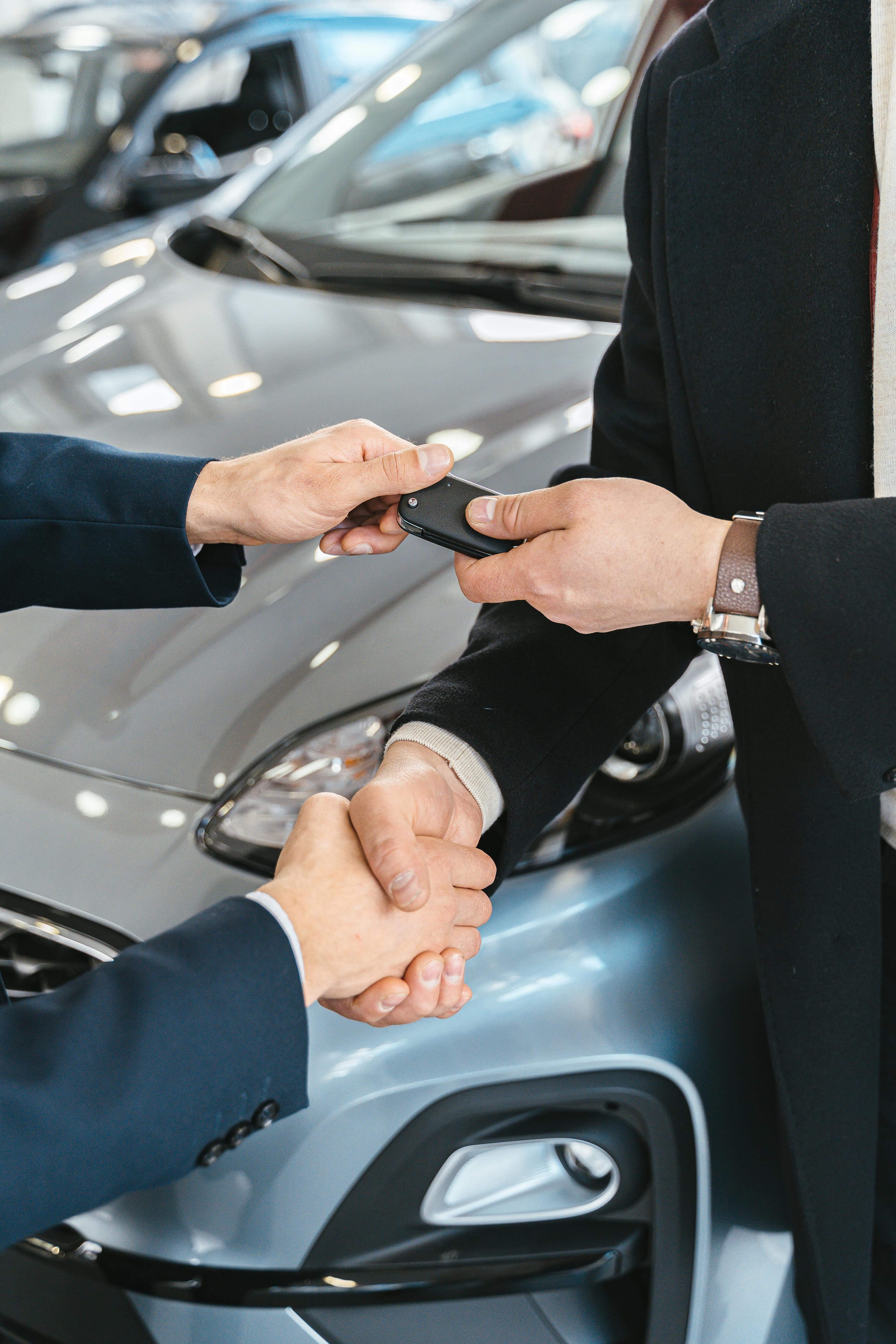 Client stepping out of a premium rental vehicle